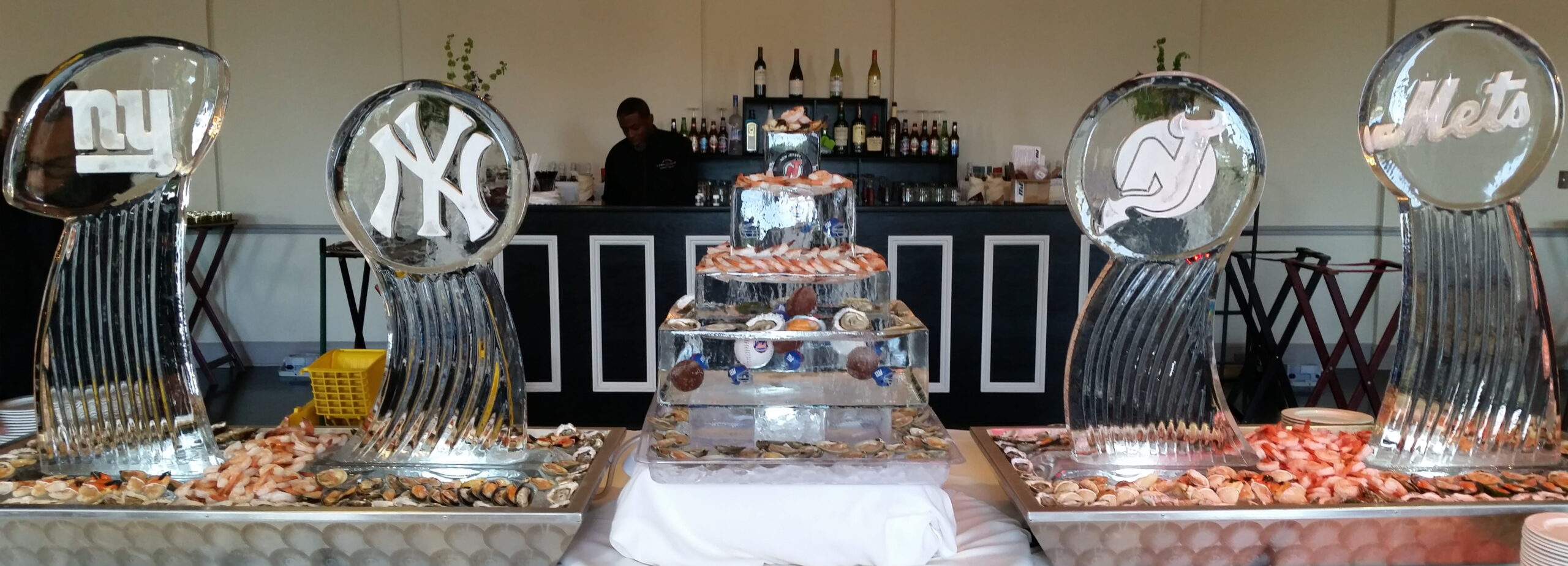 Multi-tier ice sculpture centerpiece for formal event