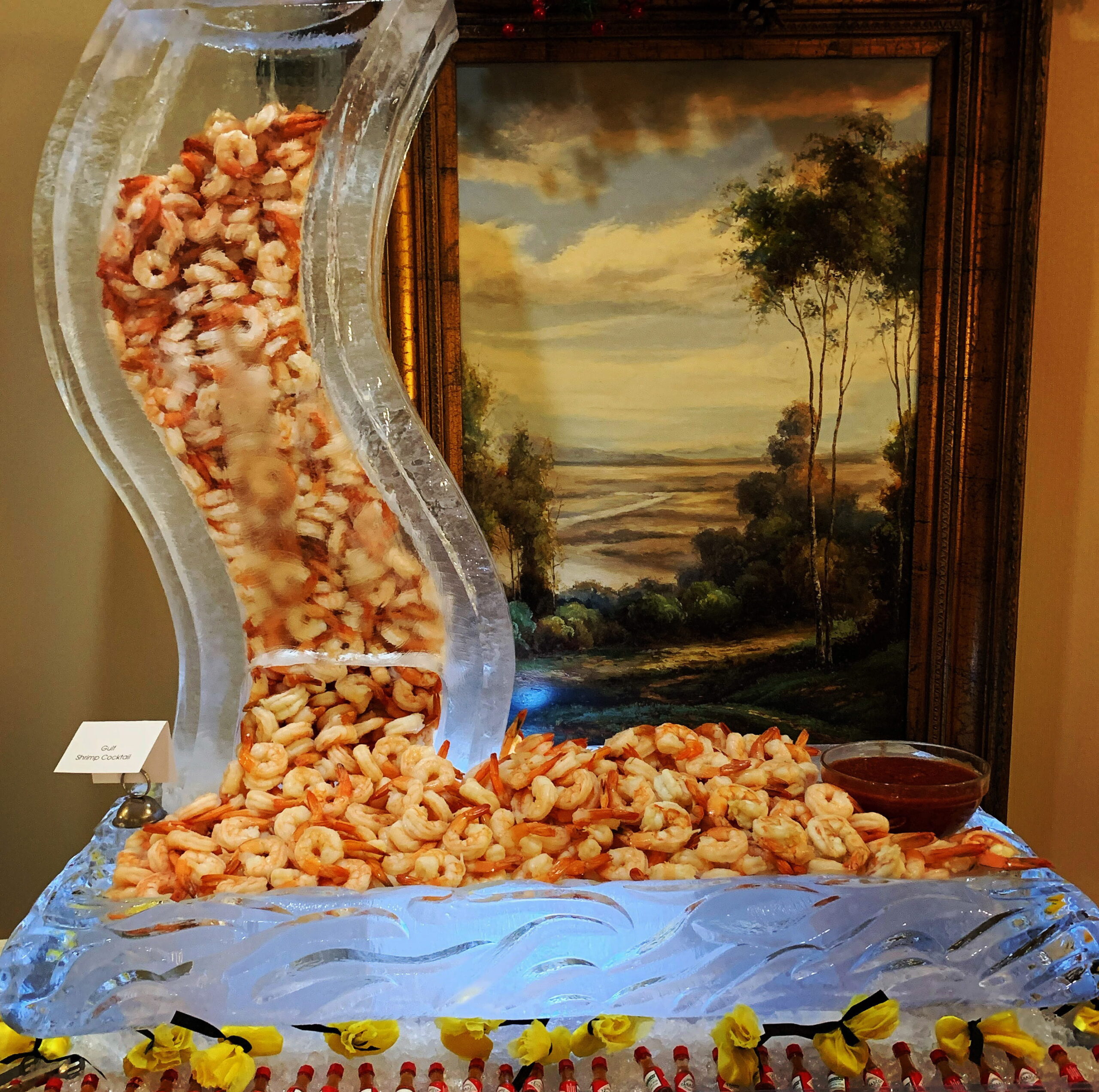 Curved buffet ice sculpture with seafood display