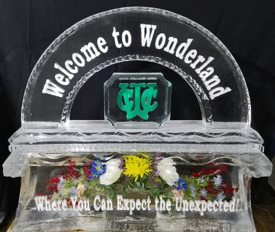 Welcome to Wonderland themed arch ice sculpture with clock detailing