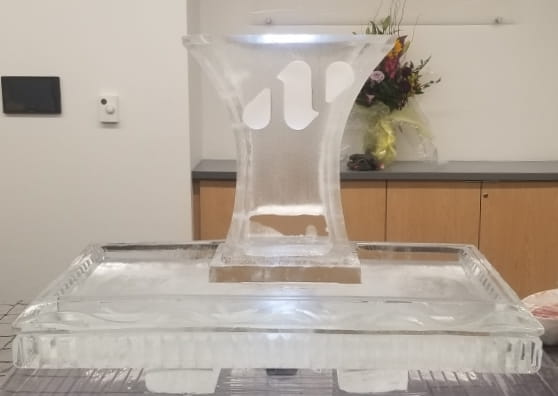 Decorative pedestal ice sculpture centerpiece