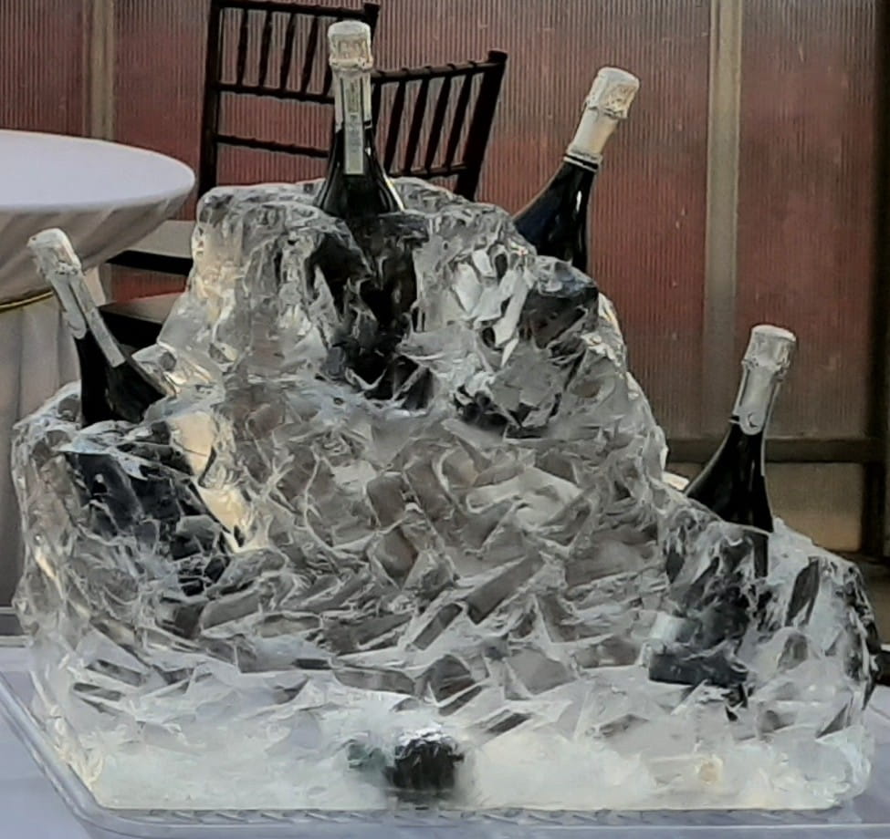 Ice wine chiller with champagne bottles