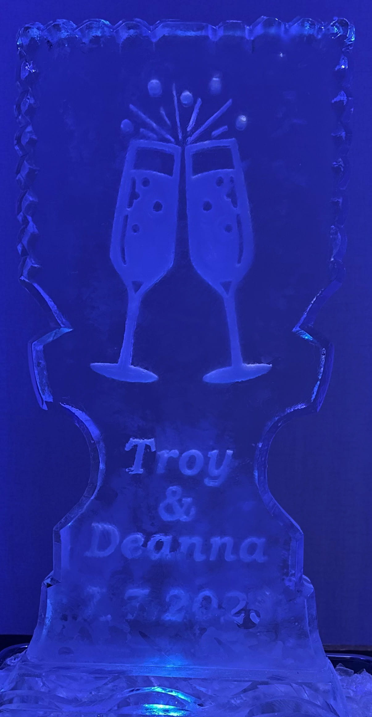 Personalized champagne toast ice sculpture