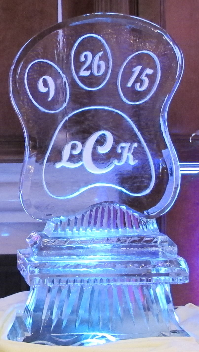 Glowing champagne glasses engraved ice sculpture