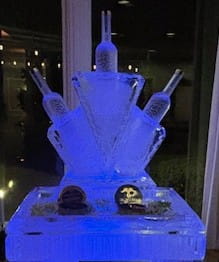 Blue illuminated crown ice sculpture