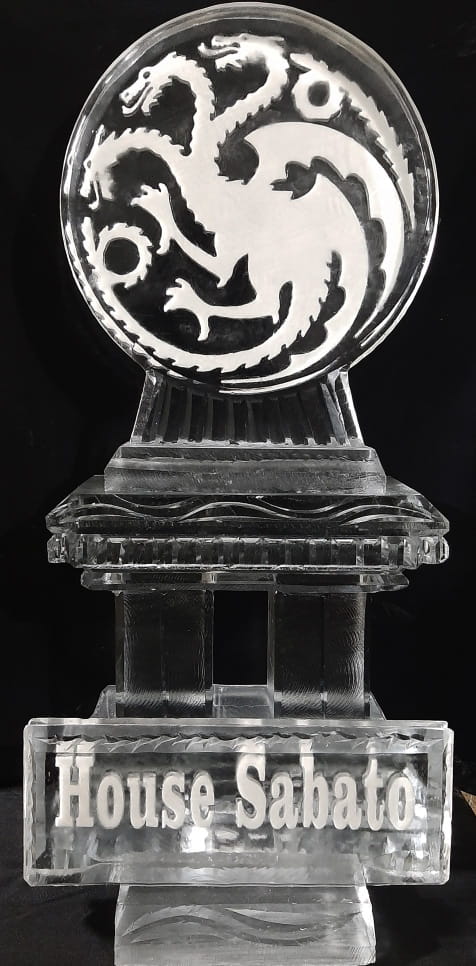 Circular crest-style engraved ice sculpture centerpiece