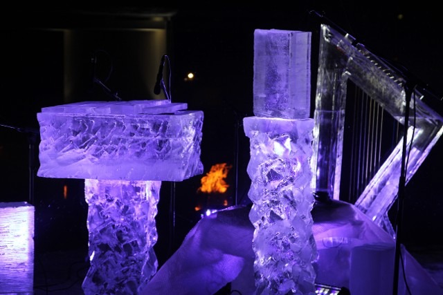 Abstract blocky ice structures illuminated with deep purple and blue light