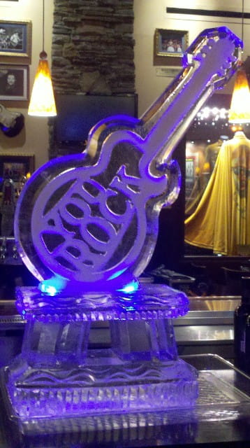 Purple illuminated guitar ice sculpture