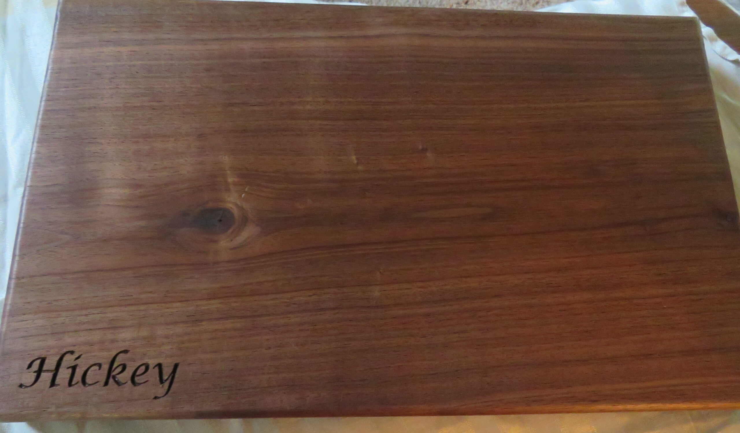 Rich dark polished wood grain texture block close up