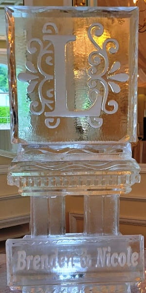 Elegant script monogram D engraved ice sculpture