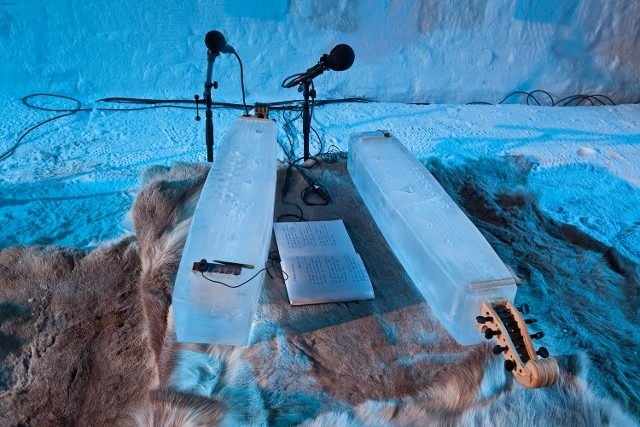 Microphones set up on clear ice blocks for an acoustic ice concert recording