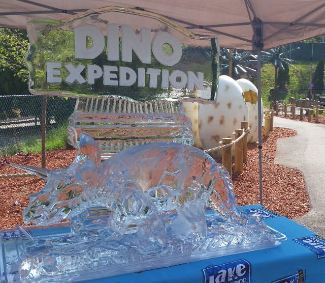 Dino Expedition custom themed event ice sculpture banner display