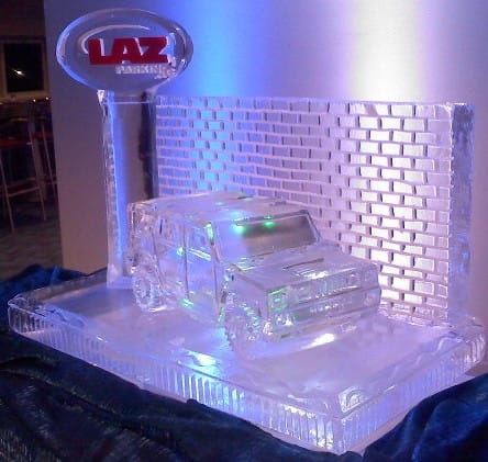 LAZ corporate logo block ice sculpture glowing with purple LED light