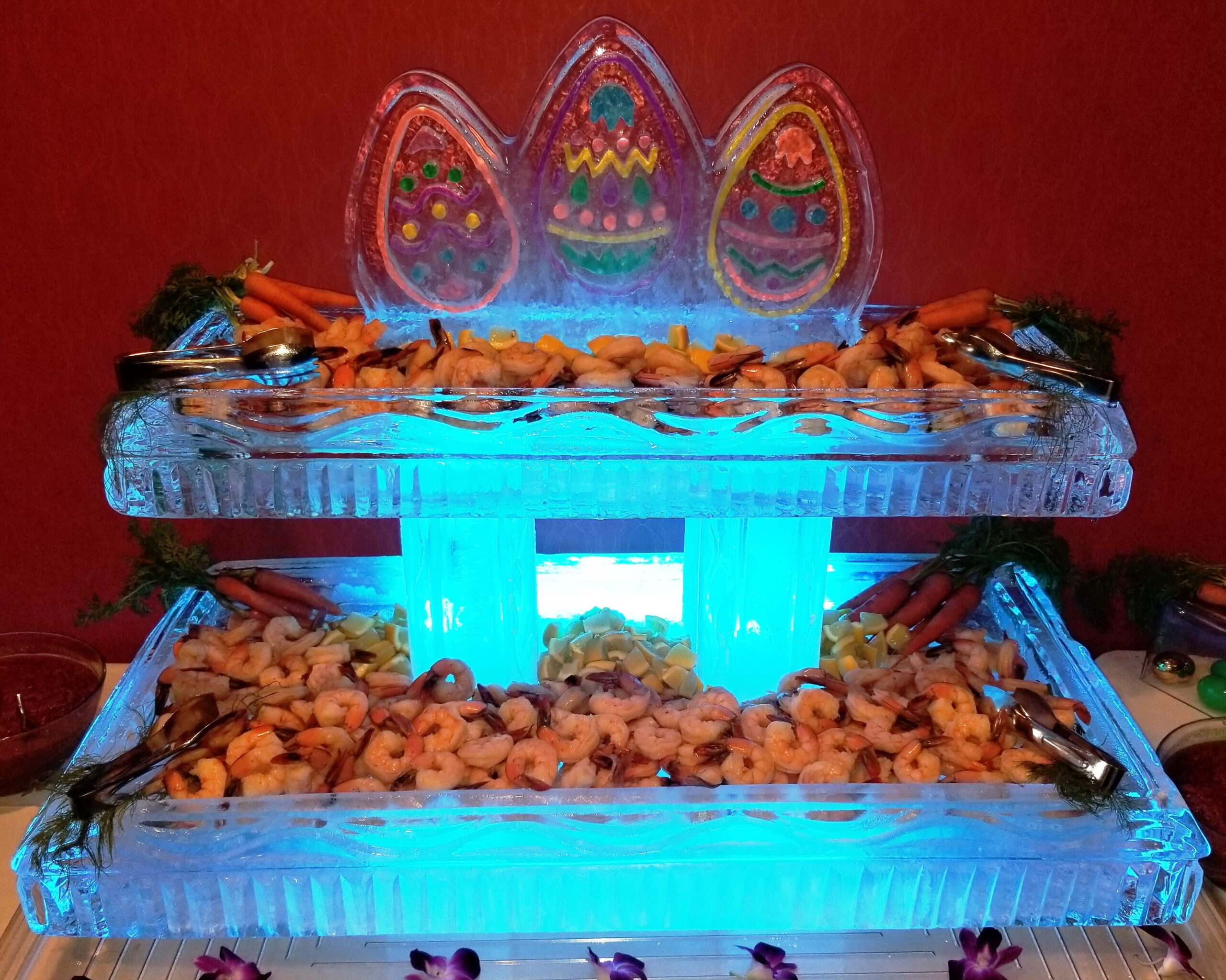 Illuminated Easter-themed ice sculpture display