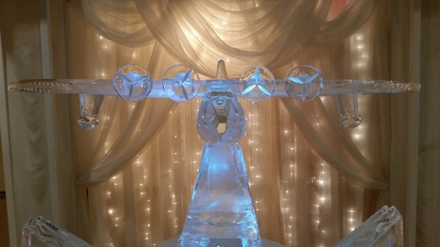 Grand multi-tiered corporate ice sculpture serving display centerpiece
