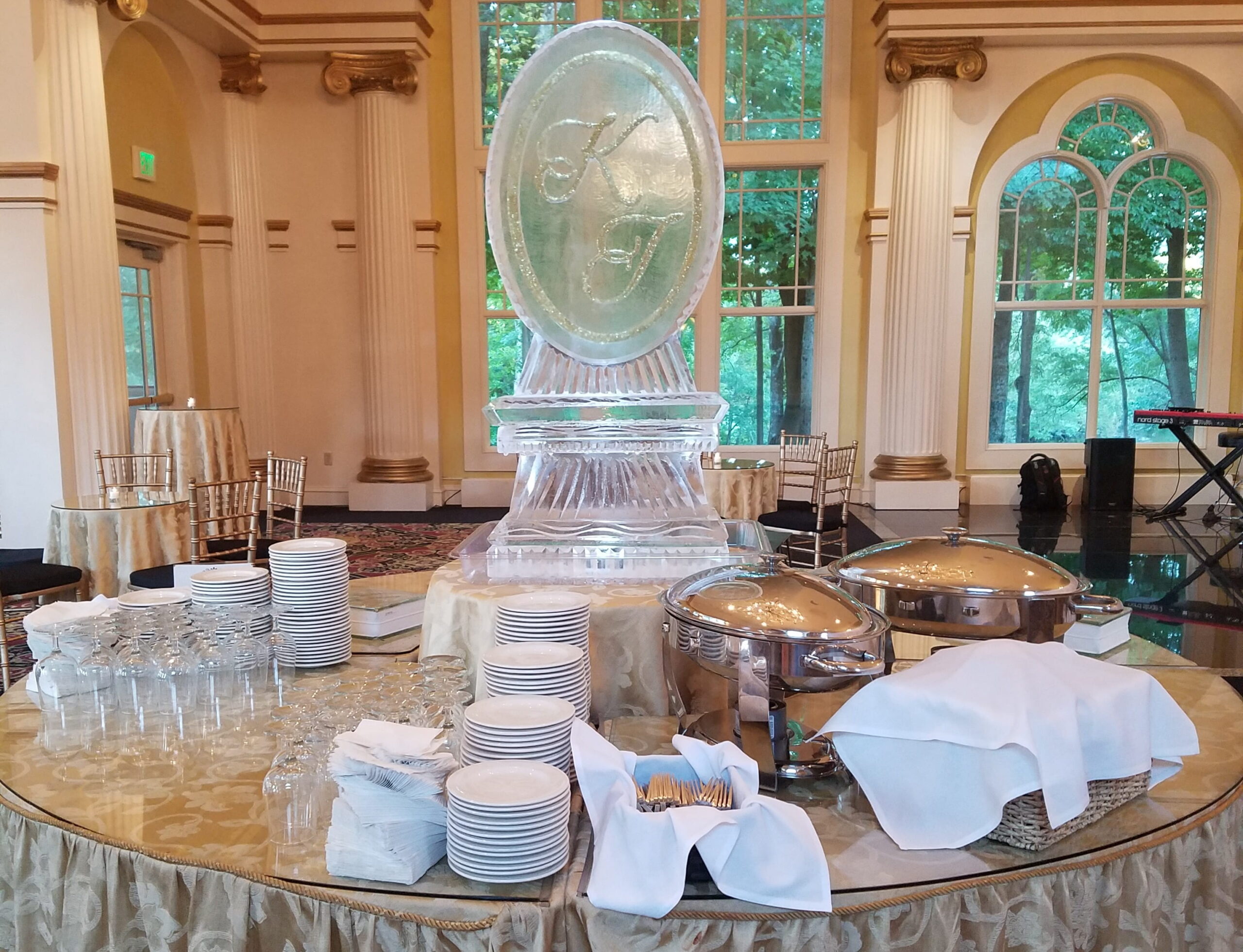 Round monogram ice sculpture displayed at an elegant venue