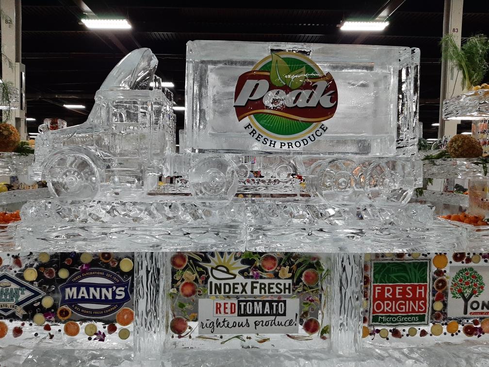 Custom food station ice carving block featuring a corporate logo