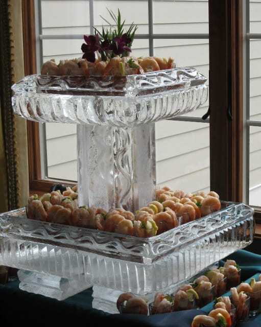 Seafood appetizer display on ice pedestal